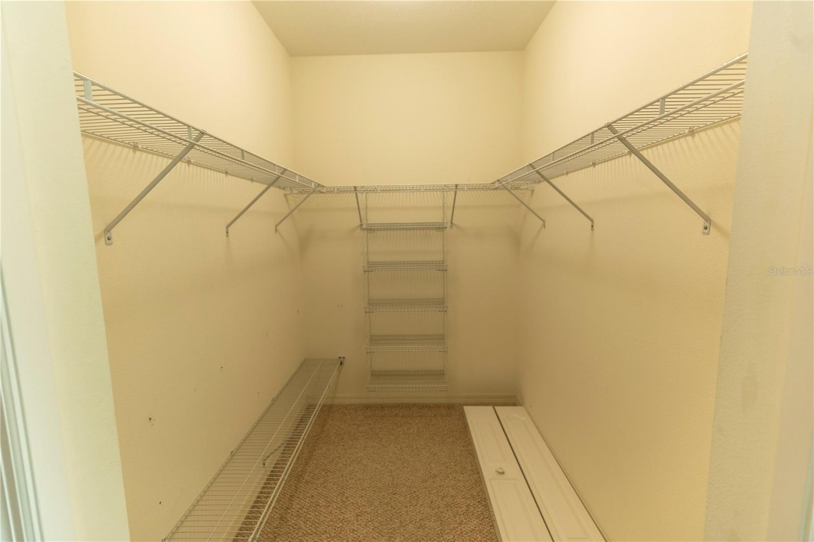 walk-in closet in primary bedroom