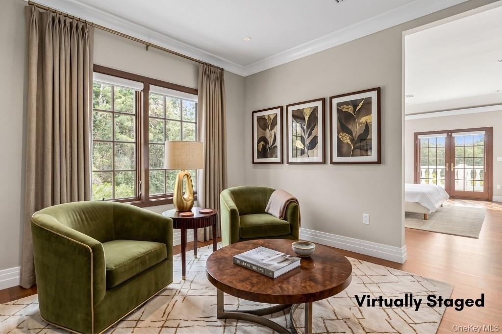 Sitting Room leading to Primary Suite, staged