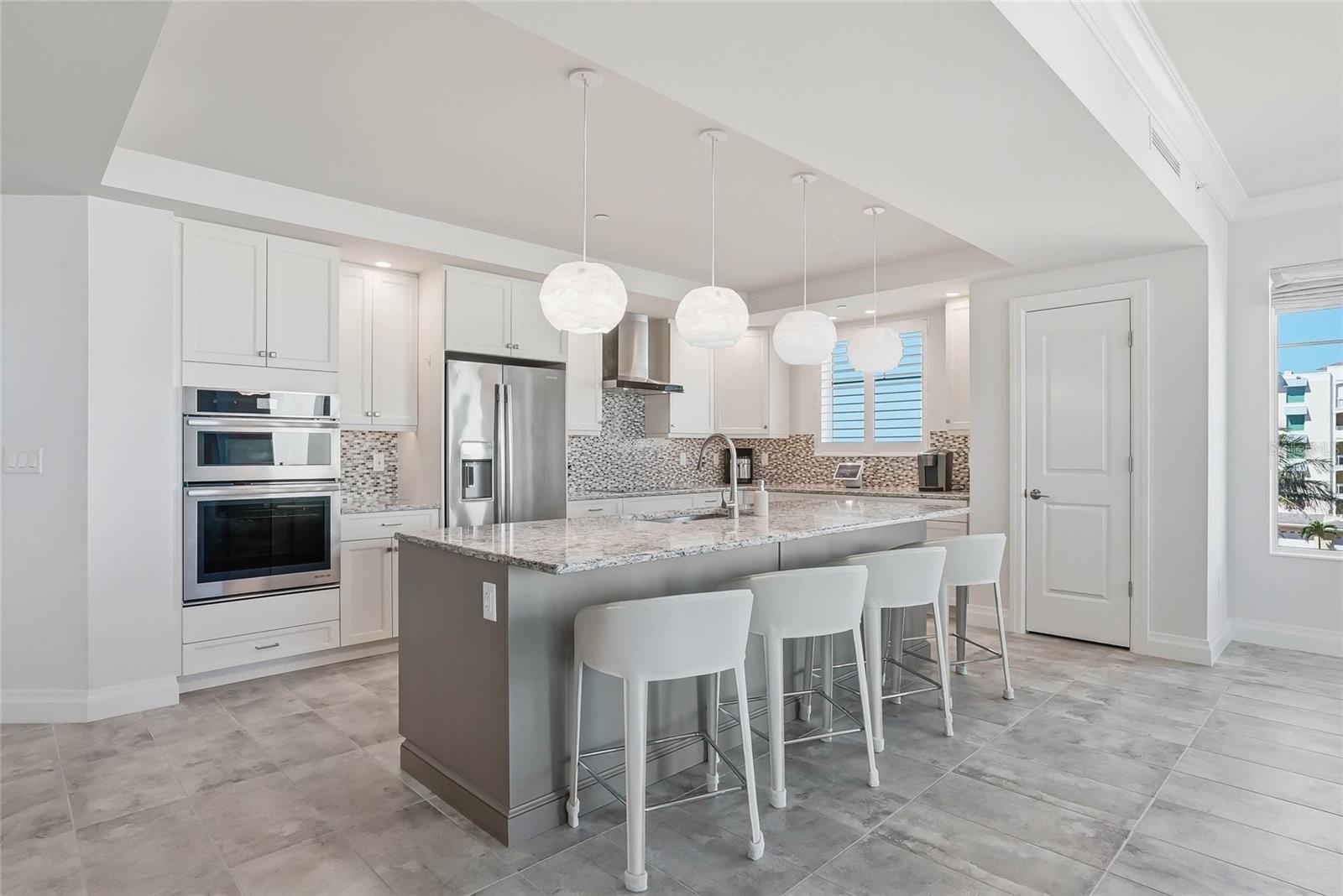 This residence has been completely designed by an interior designer - exquisite lighting fixtures and custom window treatment!