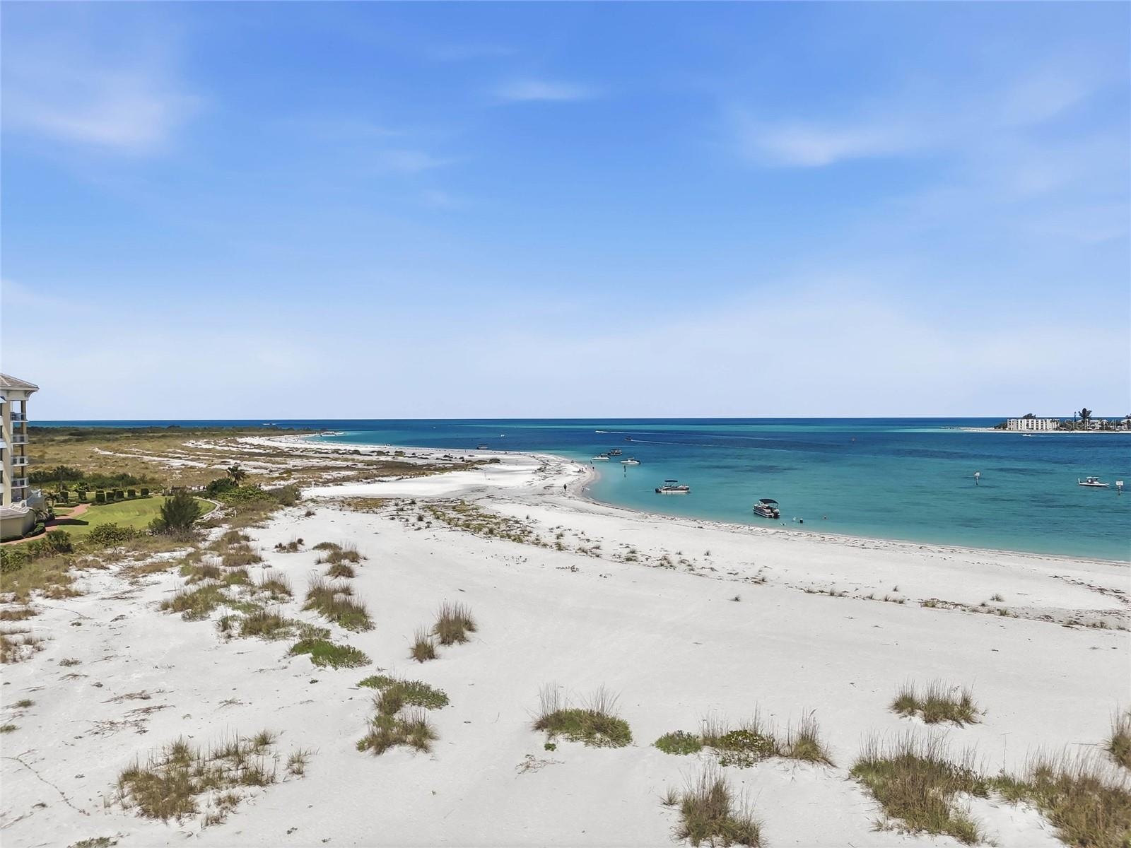 I love the sandy white beach and the ability to get into the water in the shallow areas!