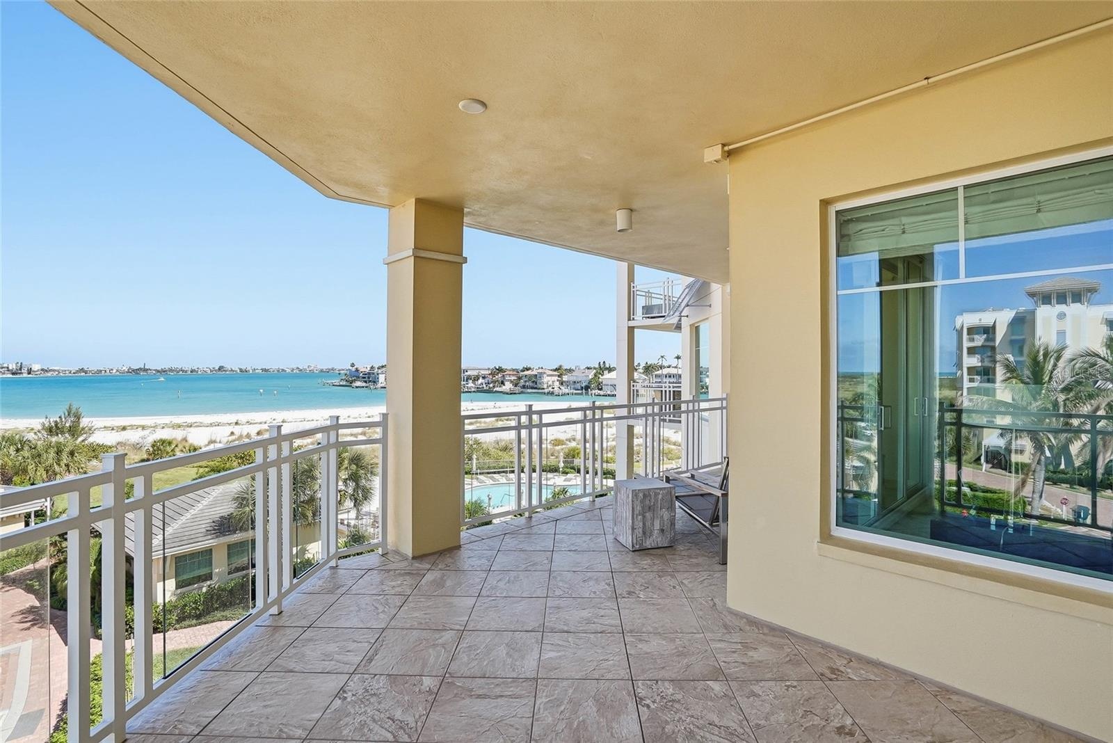 Covered waterfront balcony ideal for relaxing and there is enough room for a dining al fresco experience!