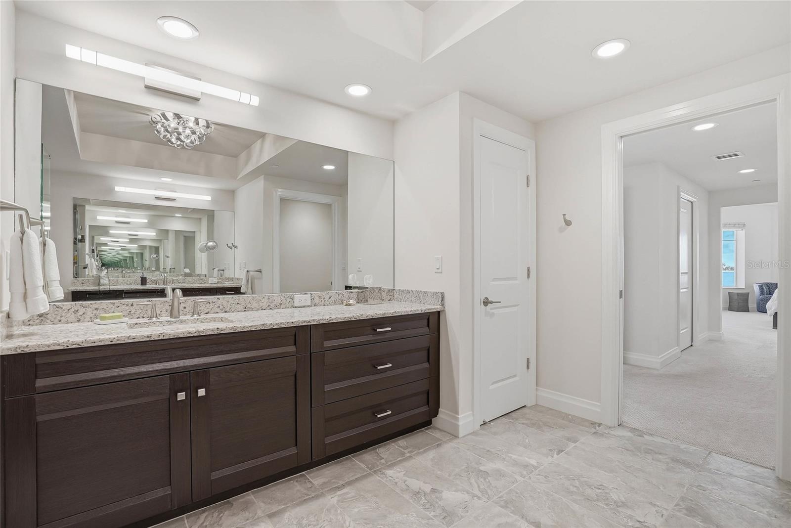 Double vanity in the primary + lots of storage .