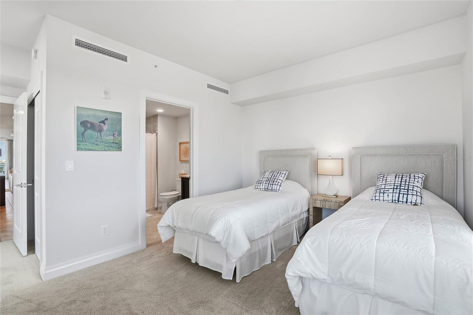 Bedroom #2 is arranged with twin beds, but a queen sized bed can easily fit and all bedrooms have ensuite bathrooms.