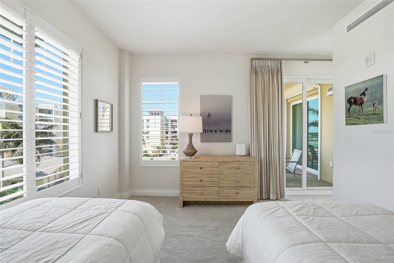 Both back bedrooms have balcony #2 access.  A cool feature is at nights, you can softly hear the music from Billy's!