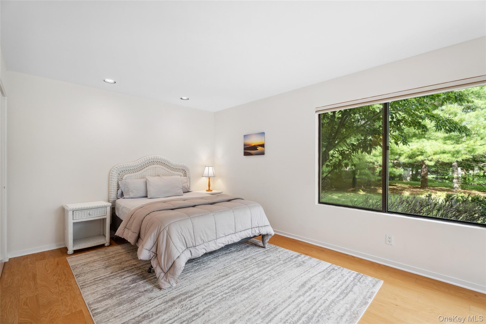 Bedroom featuring light wood finished floors and recessed lighting