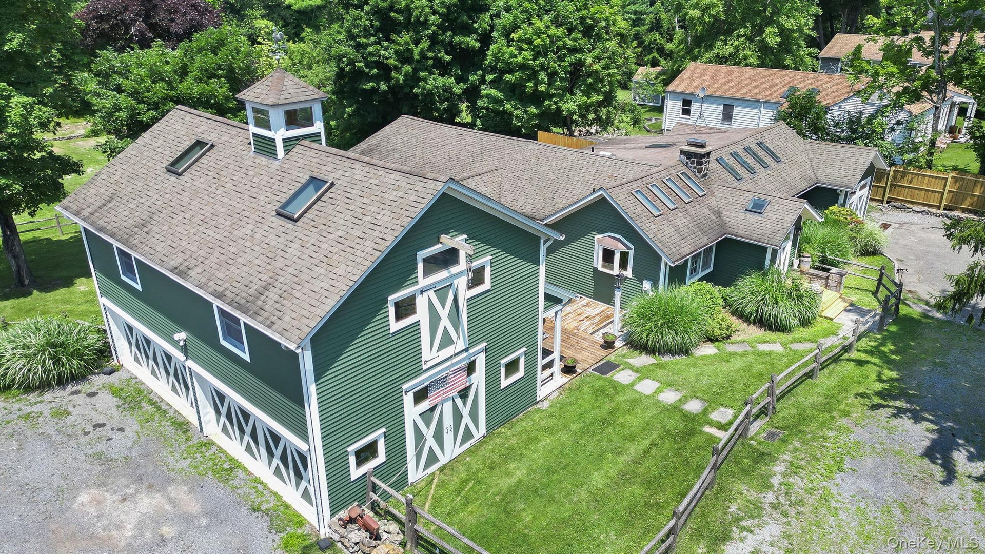 Featuring a multi-gabled roofline and multiple skylights.