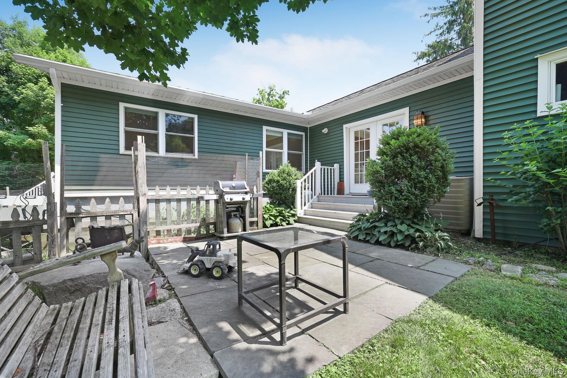 Back of house patio and seating area.