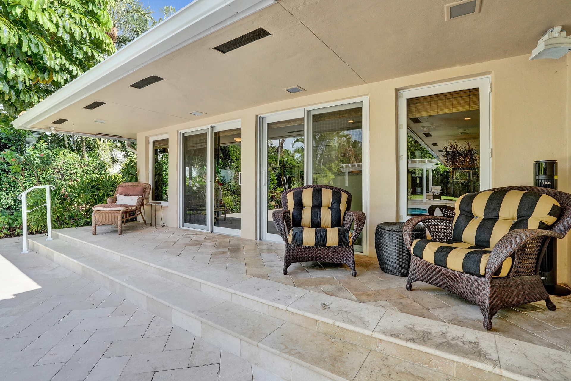 Breakfast nook, kitchen doors leading leading out to pool and backyard area