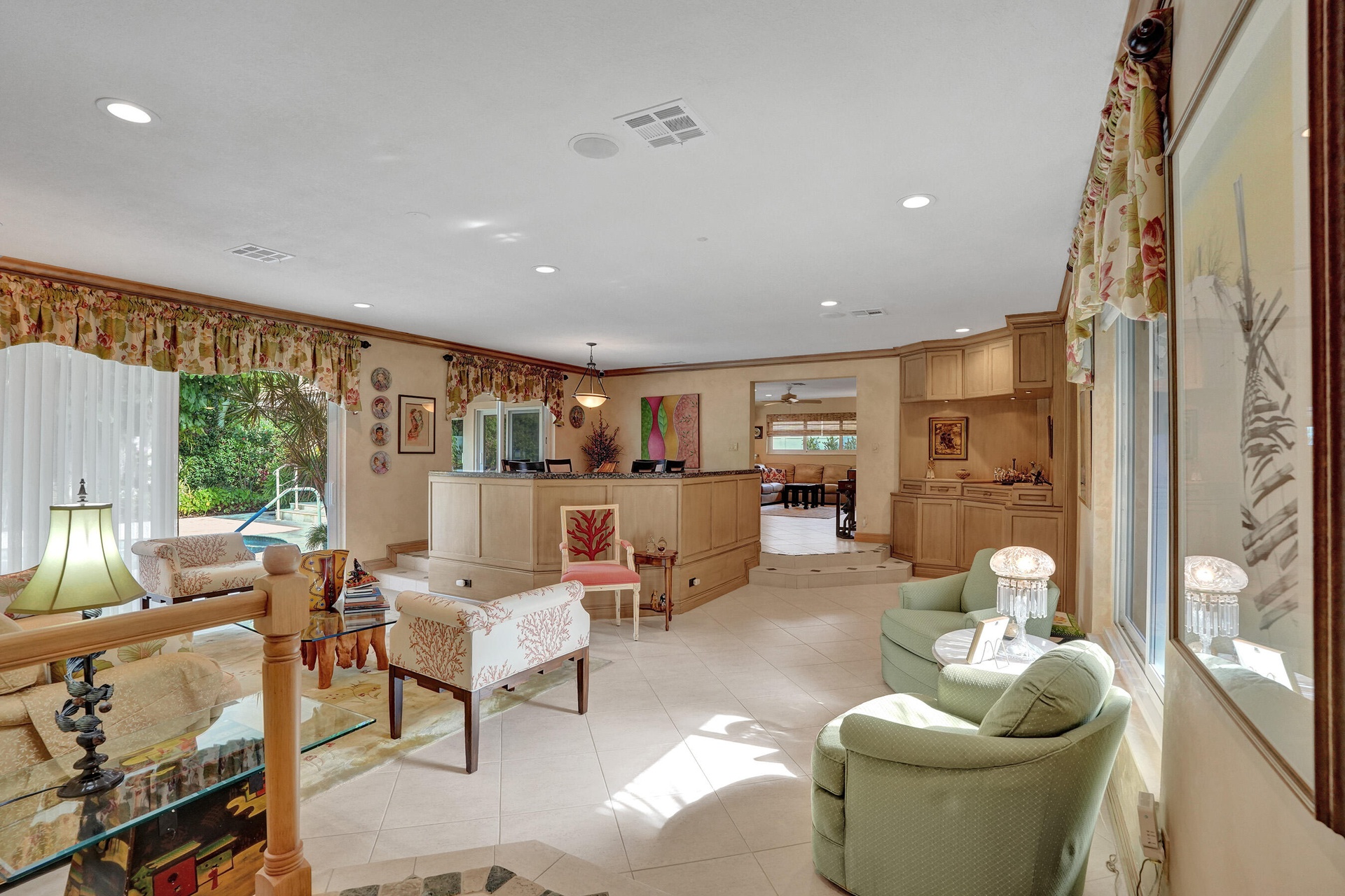 Open living room and dining area. Family, dining, breakfast nook toward the back right of the photo.