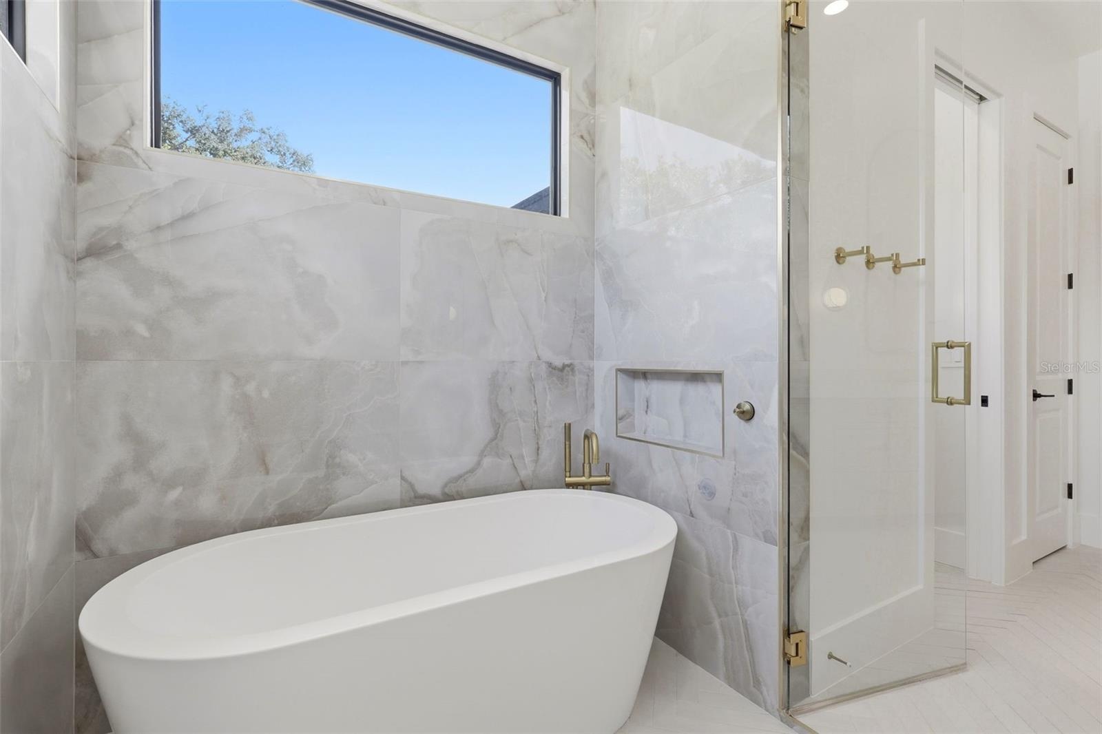 Primary bathroom with dedicated wet area