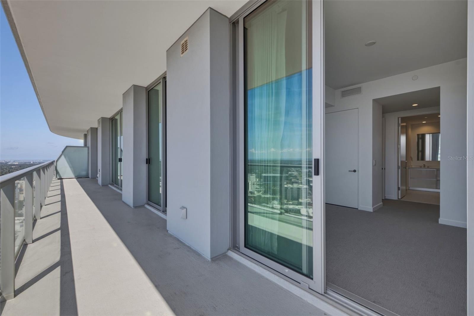 Sliding doors and balcony off each room