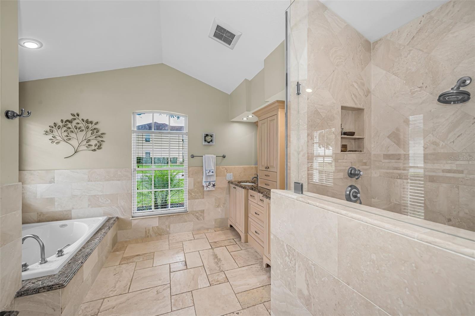 Primary bathroom w/separate soaking tub and shower