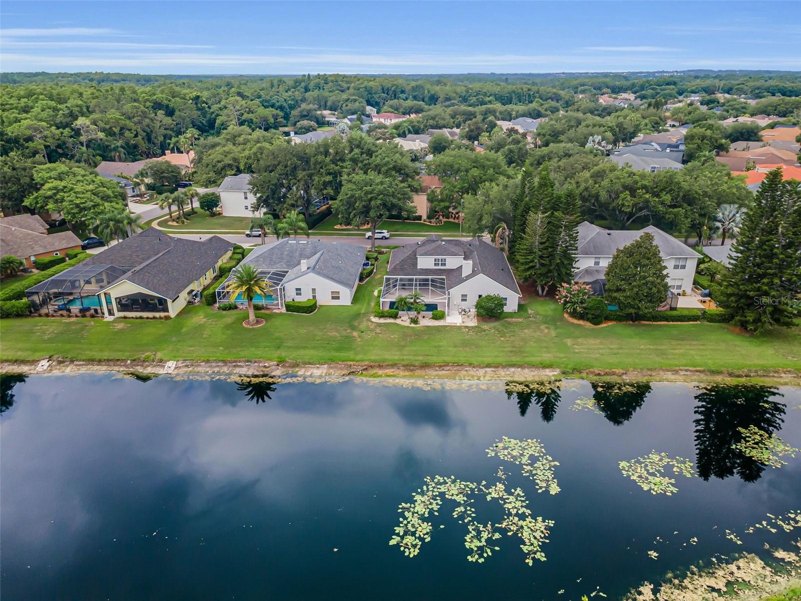 Aerial view of pond and home