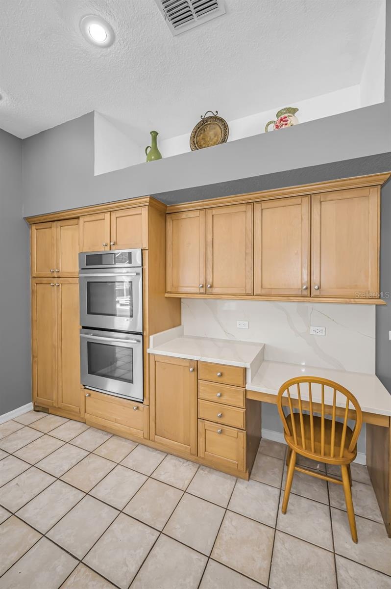 Kitchen w/double Jenn-Aire ovens and desk space