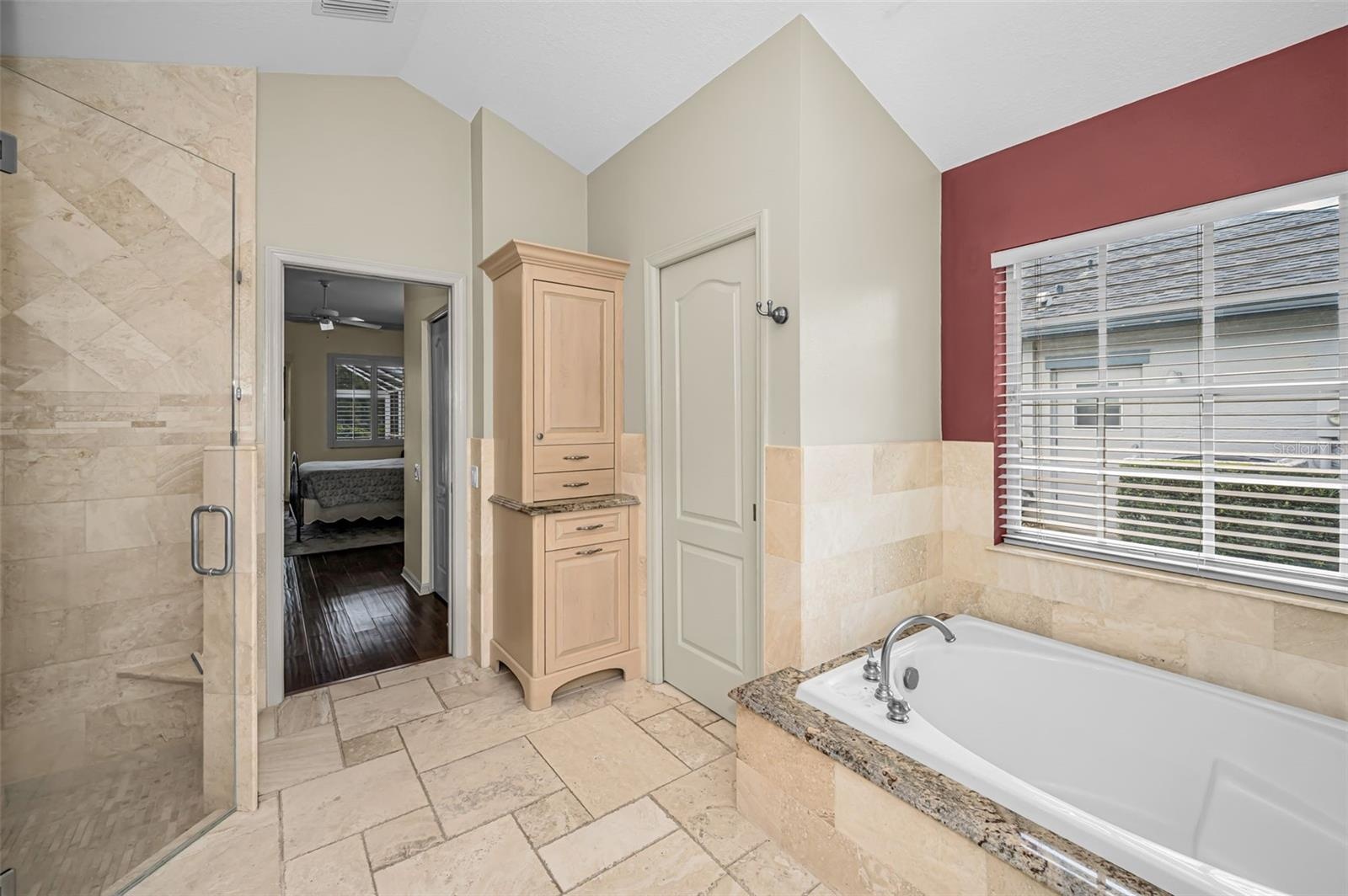 Primary bathroom with pocket door to water closet