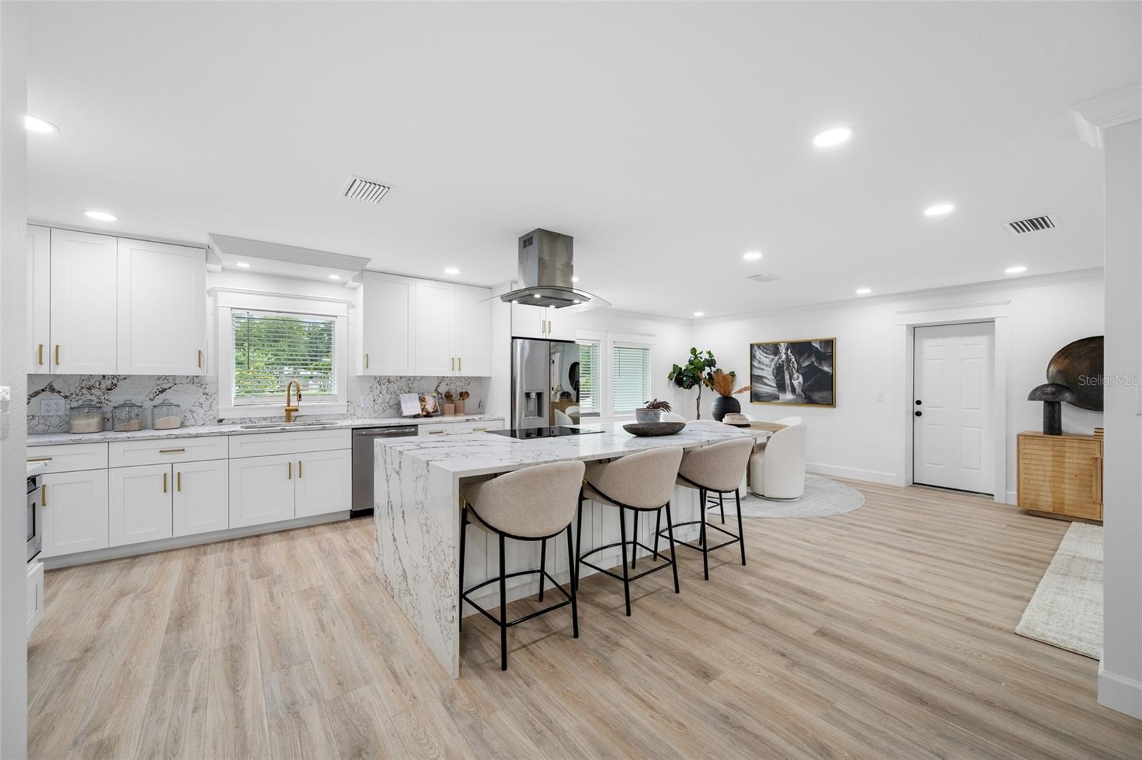 Open-Concept Kitchen with Quartz Island and Seating for Casual Dining