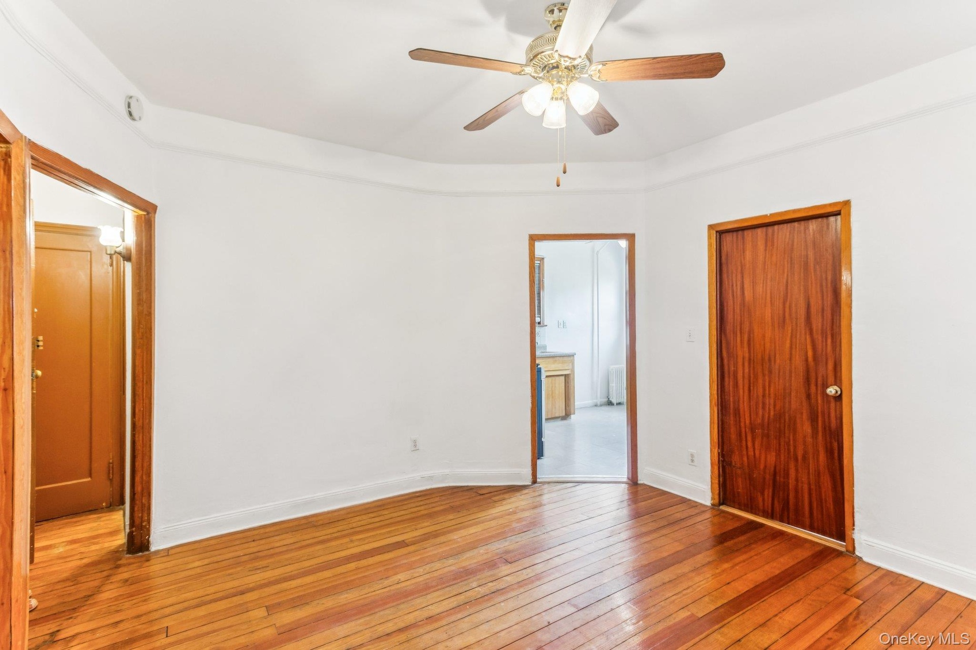 Unfurnished bedroom featuring light wood finished floors and ceiling fan