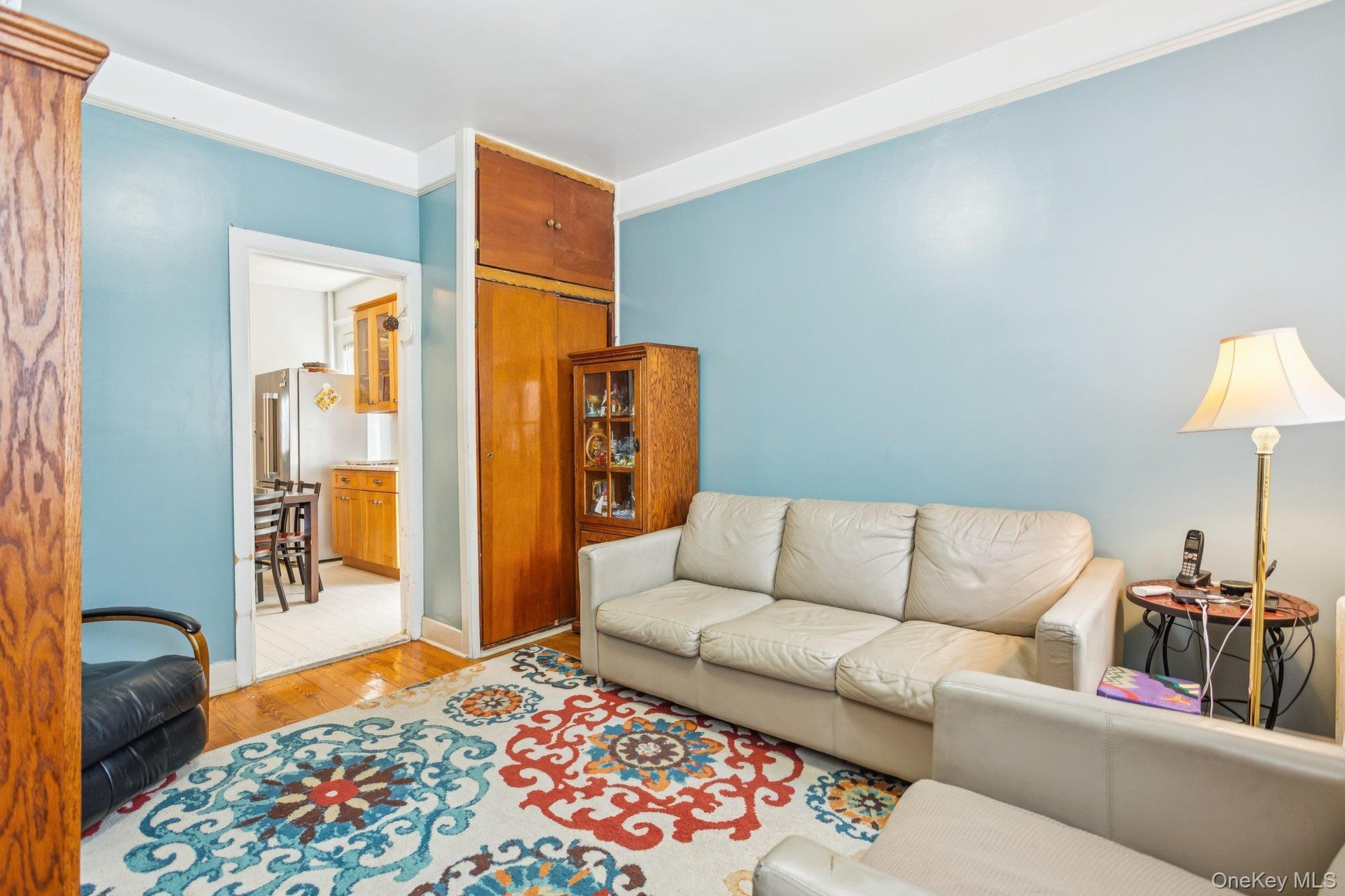 Living area featuring light wood-style flooring and baseboards
