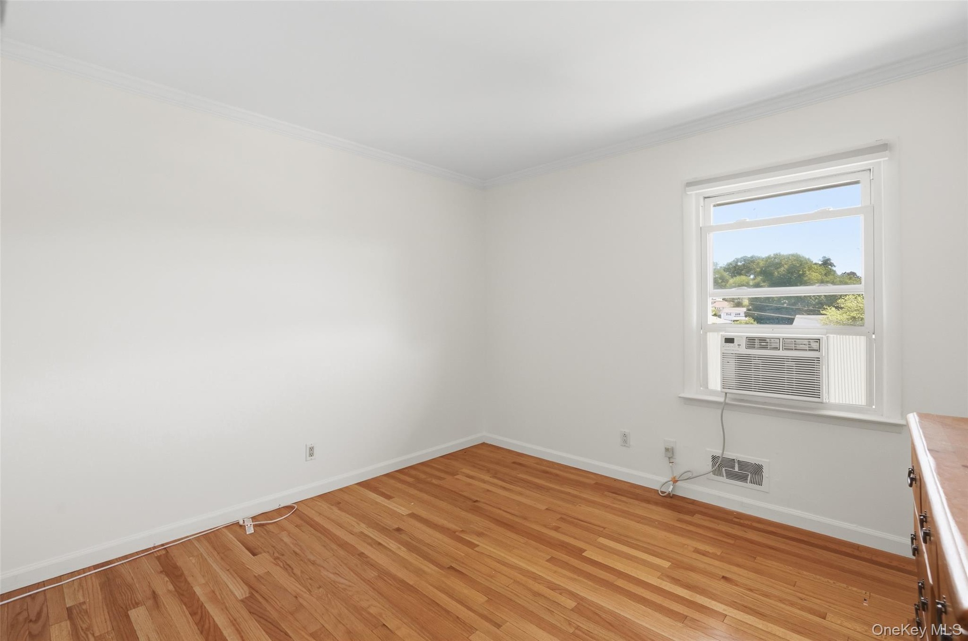 Bedroom 1 with window air conditioner.
