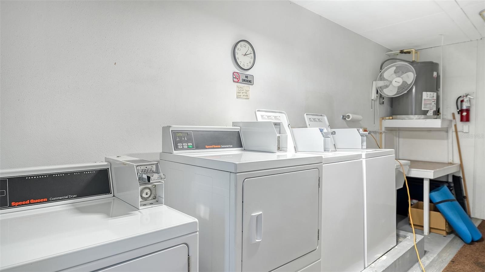 The building's coin-operated laundry room is located just outside the front door of unit H24.