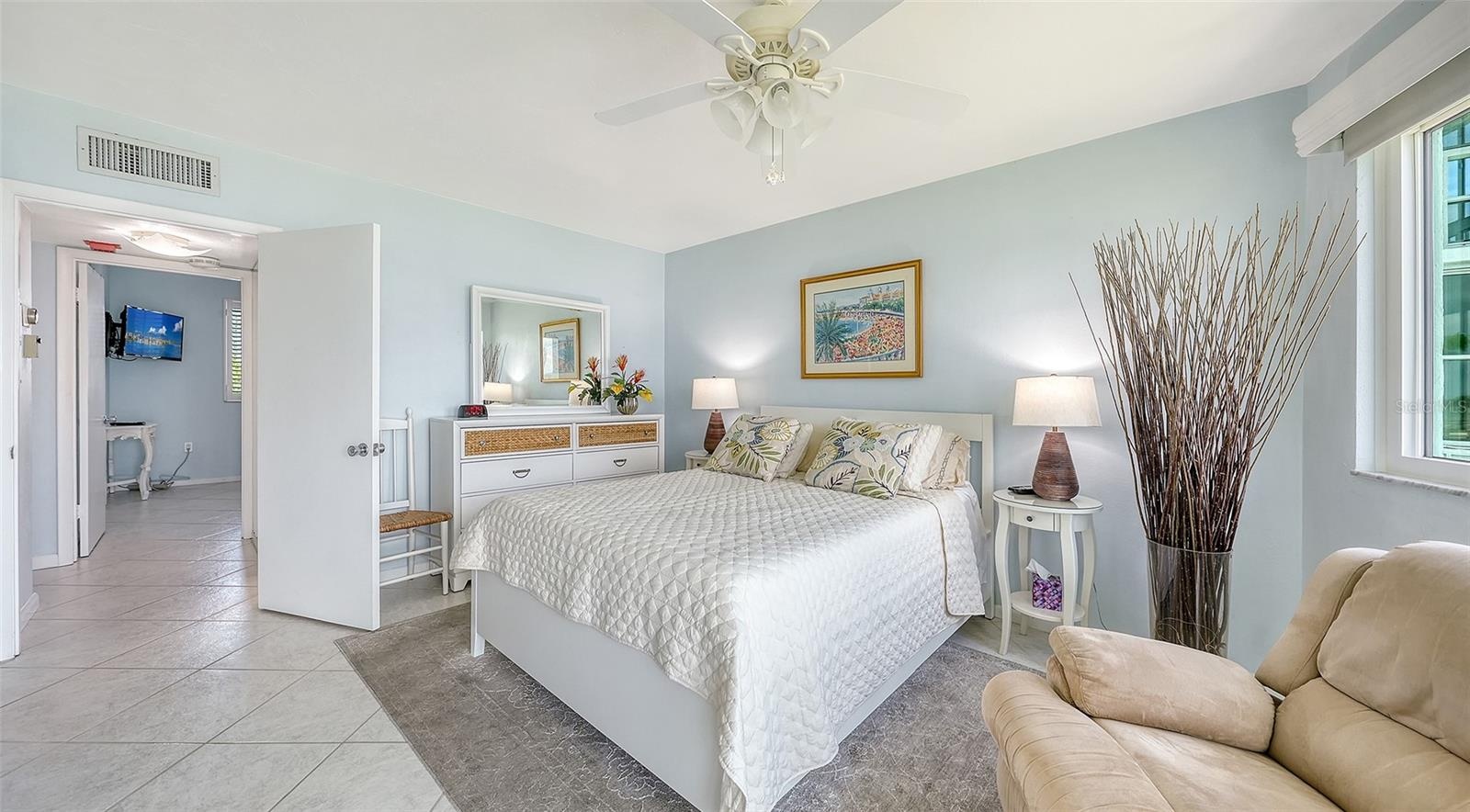 The primary suite is turnkey furnished, like the rest of the condo