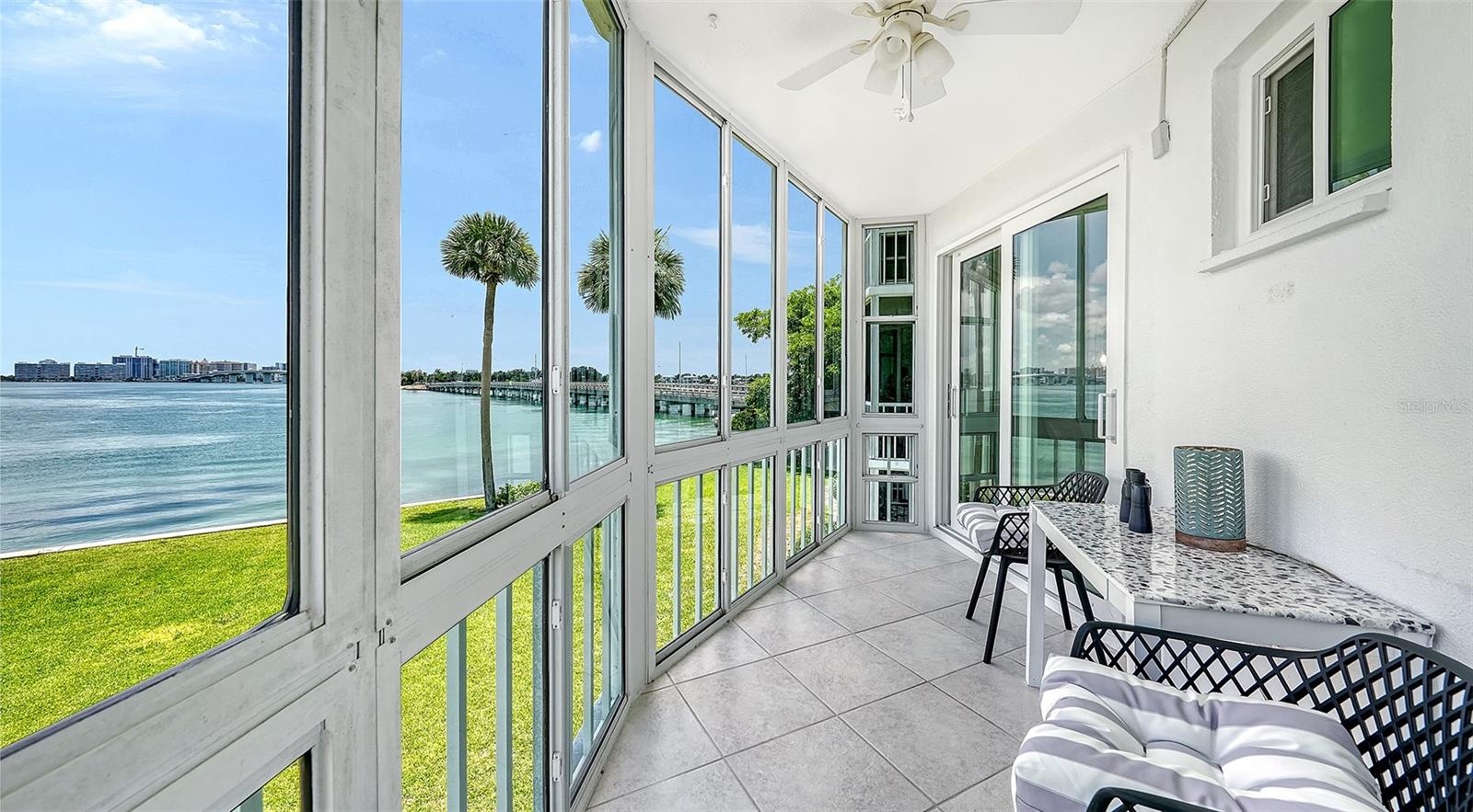 The enclosed lanai offers hurricane impact windows that slide open so you can enjoy the sea breeze