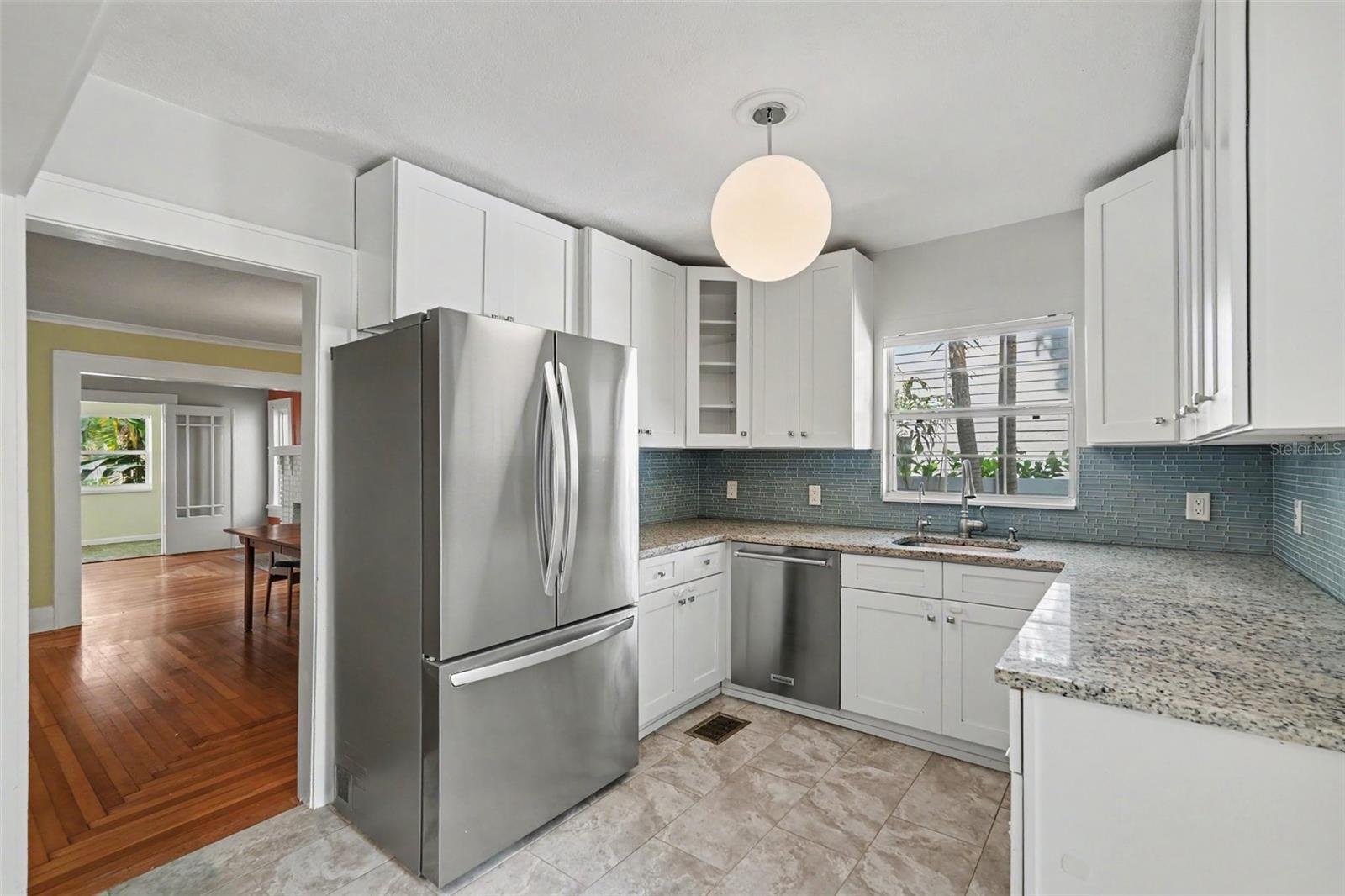 Thoughtfully designed storage and counter space make this bright kitchen as practical as it is welcoming.