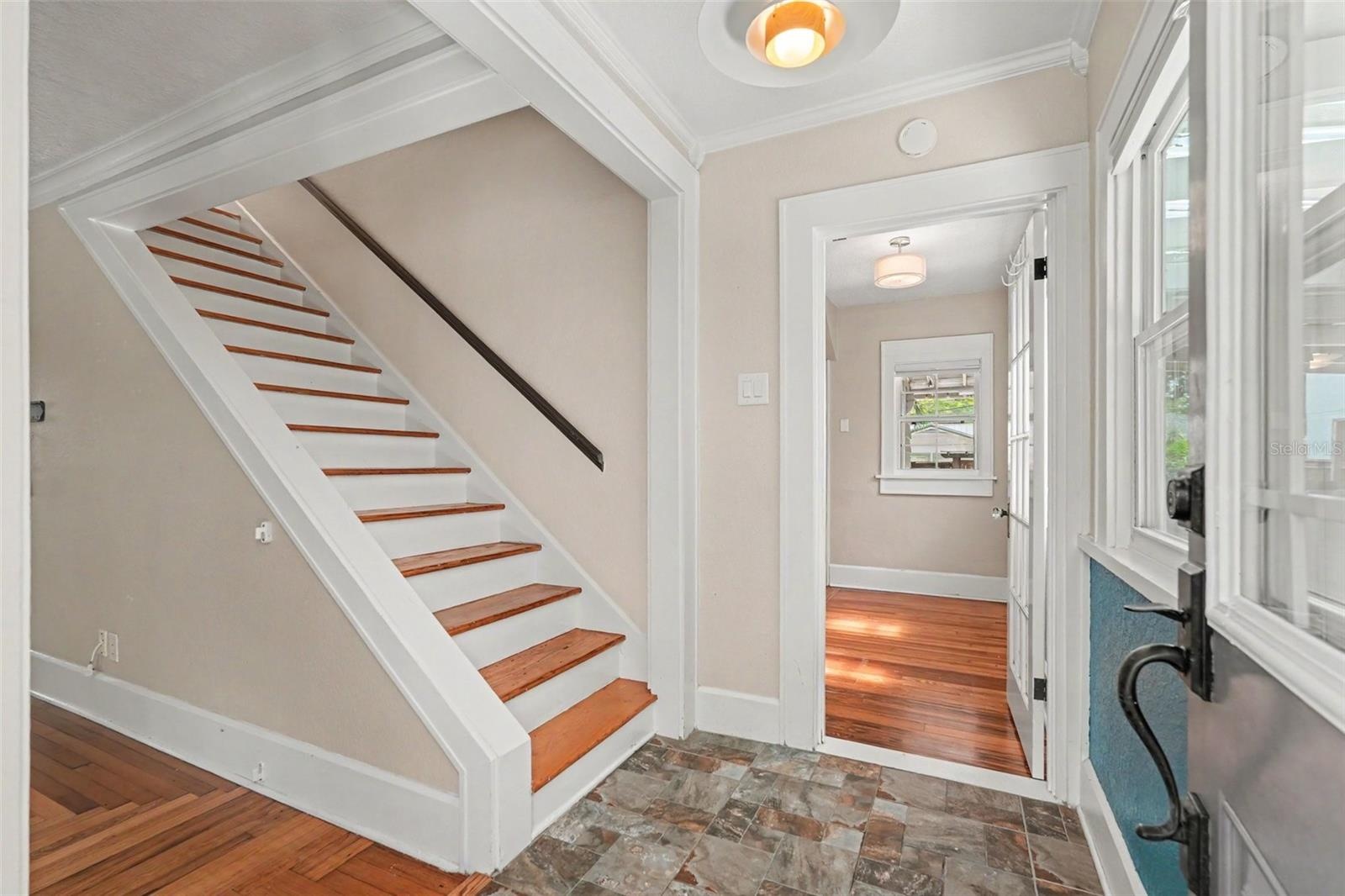 Inside the home you will discover the original details that make this home special, including beautiful heart pine floors and vintage Cuban tile.