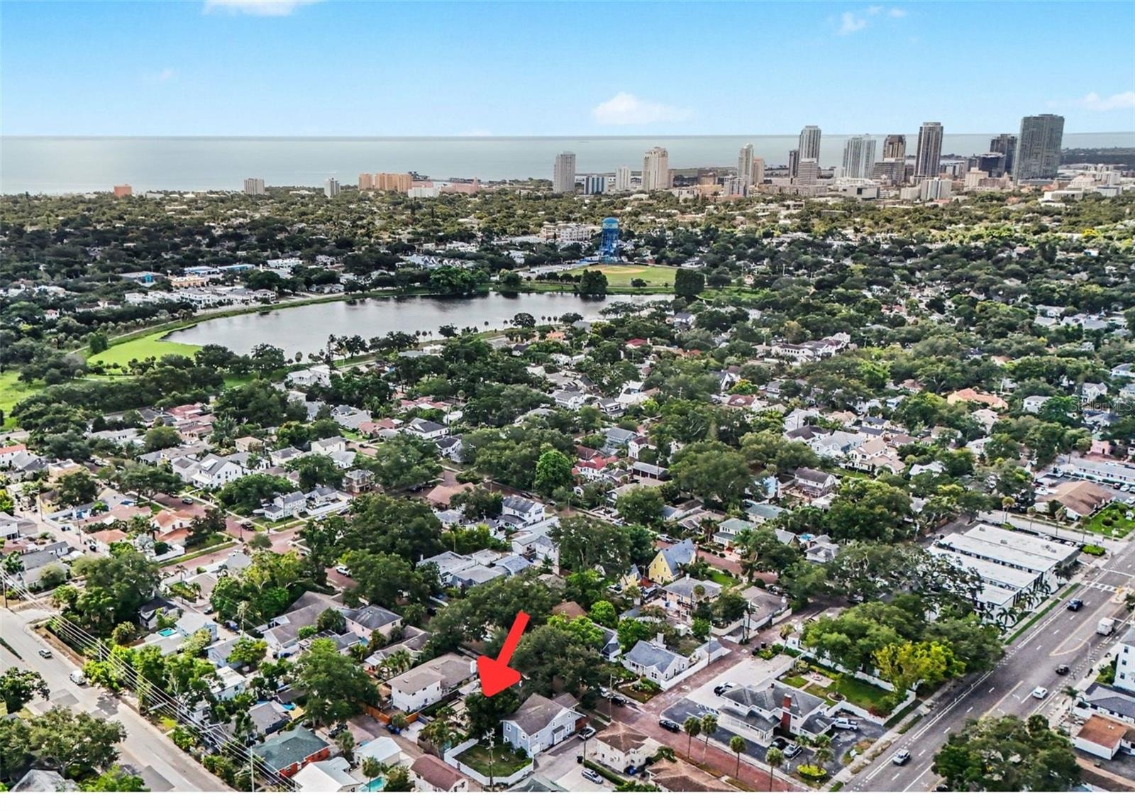 Aerial views highlight the home’s exceptional location near Crescent Lake Park, with downtown St. Petersburg and the waterfront just beyond.