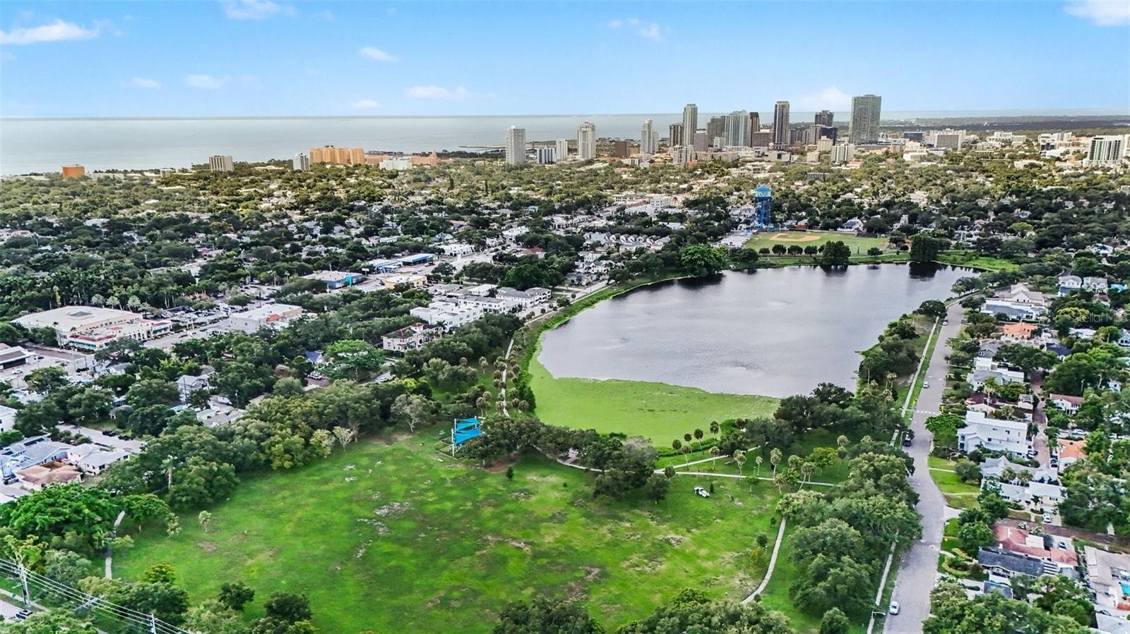 Crescent Lake Park’s scenic waterfront, walking paths, and expansive green space are close by, with downtown St. Petersburg rising in the distance.