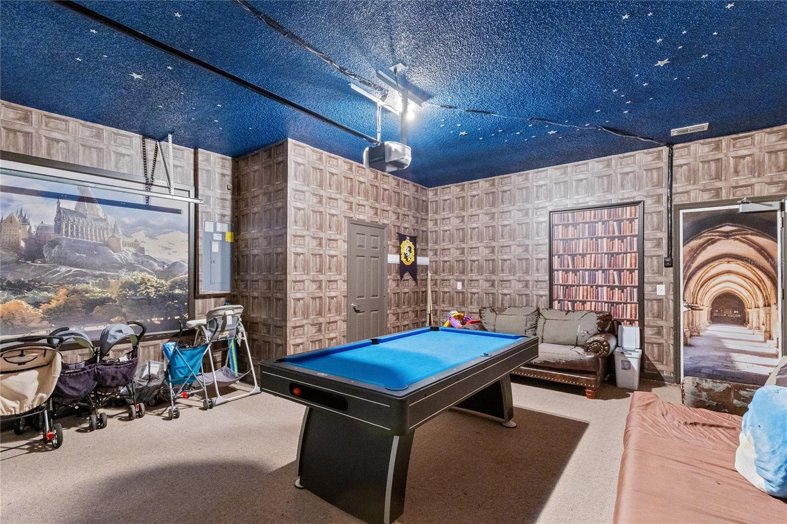 Garage has been converted into a semi play area.