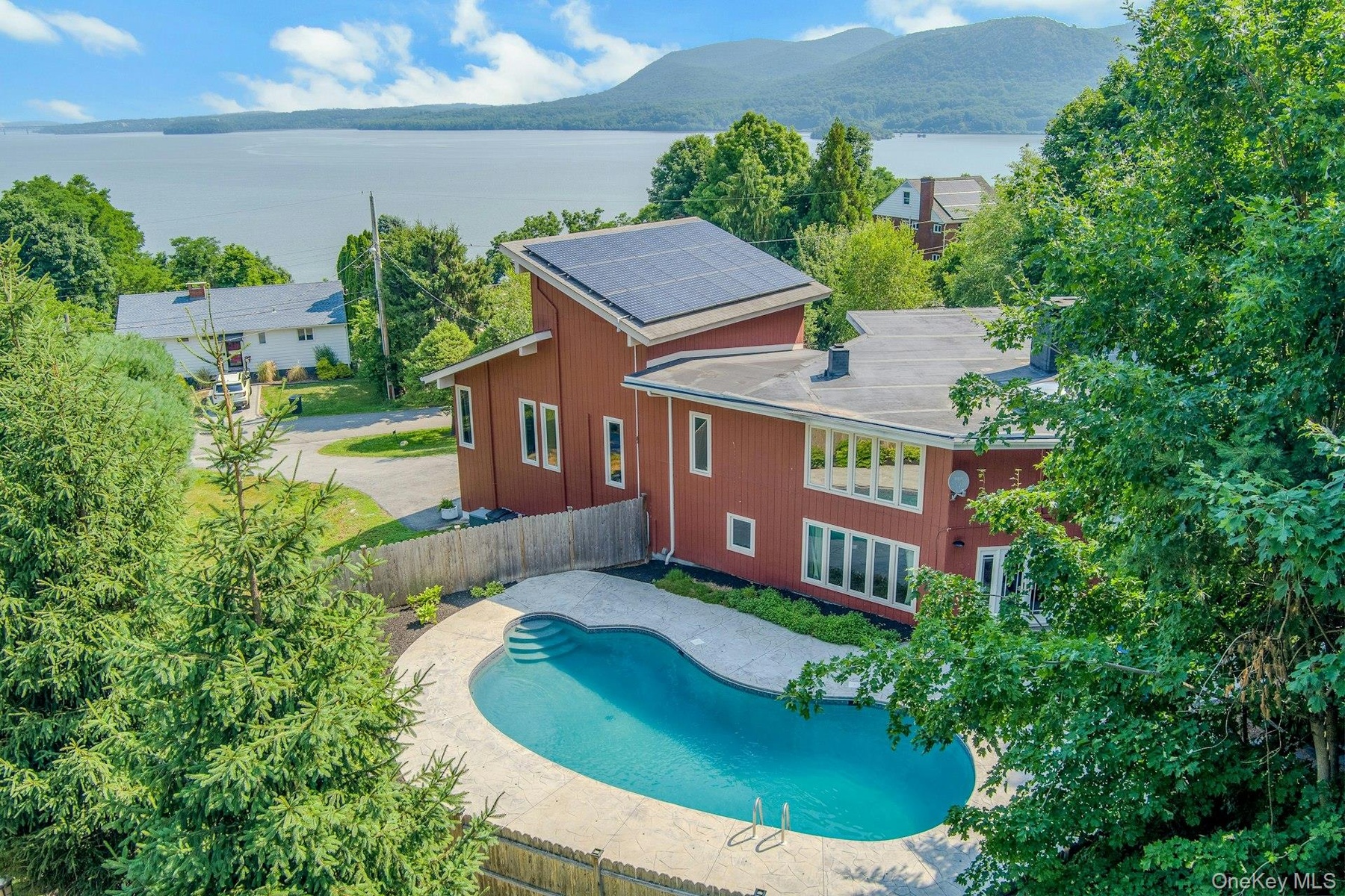 Stunning Hudson River views, gorgeous updates, a flexible floorplan and a dream pool  - all to be found in this Hudson Highlands retreat at 6 Grandvie