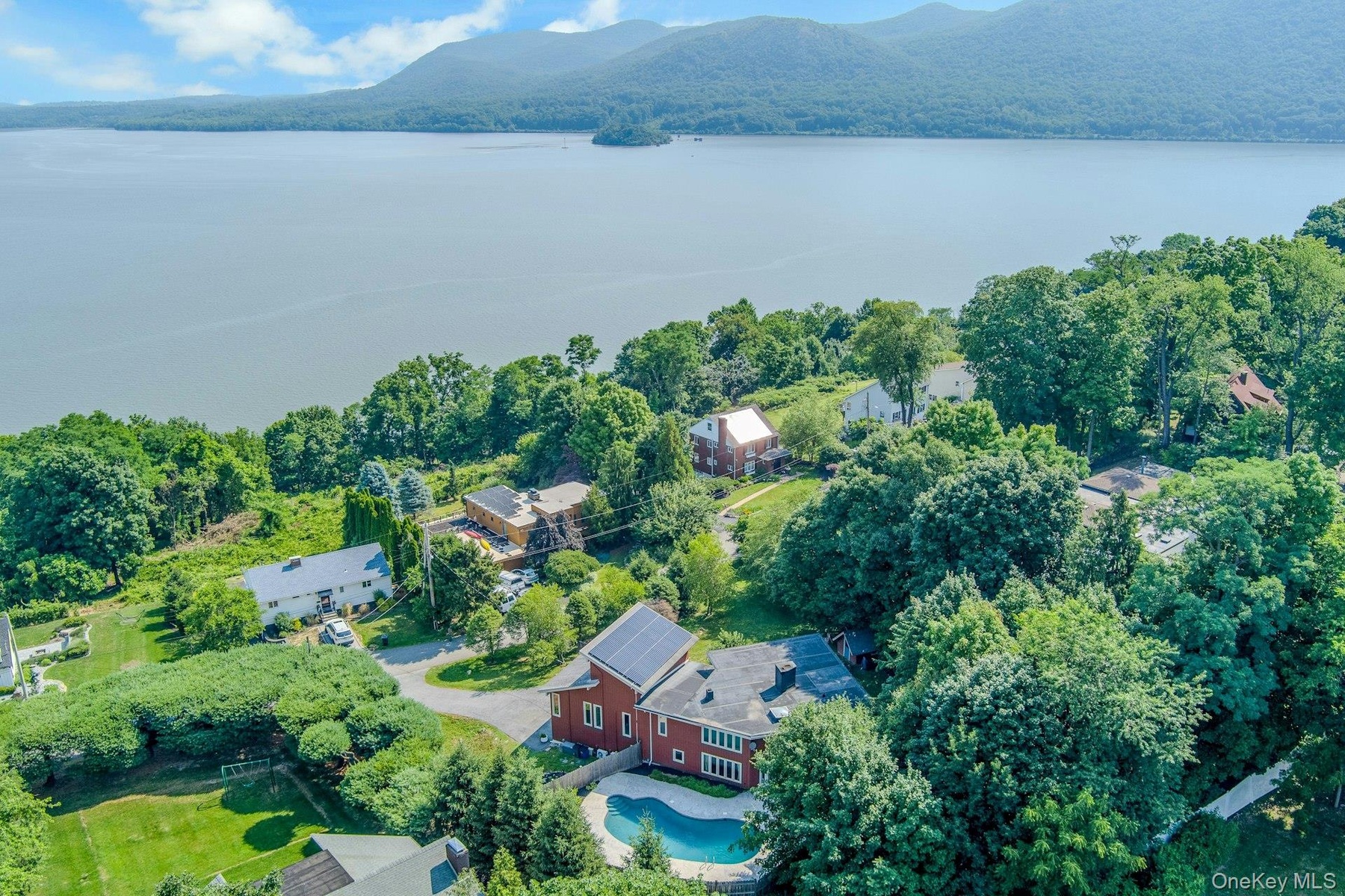 Rising even further, we look out to the beautiful Hudson River, on whose bluff this home sits.