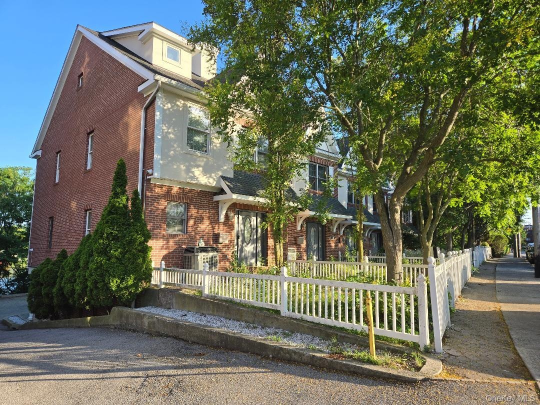 Front of the complex featuring freshly restored and painted exterior and trim!