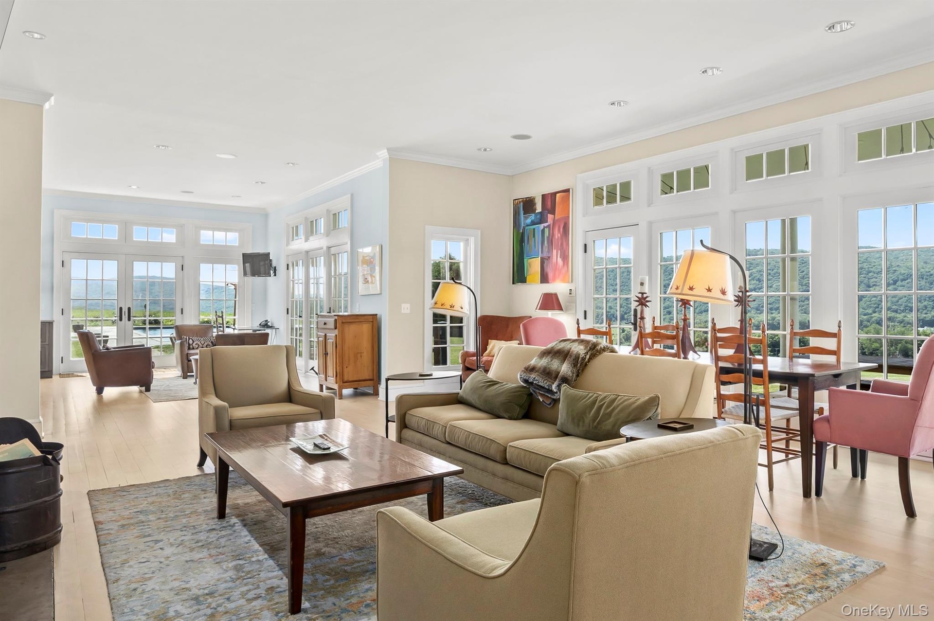 A Stunning Light-Filled Living Area, Dining Area and Kitchen all have Tons of Glass & Outdoor Access