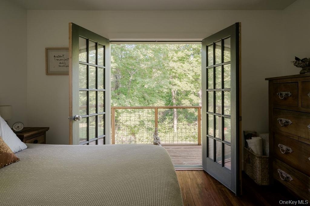 First floor primary bedroom opens to private deck