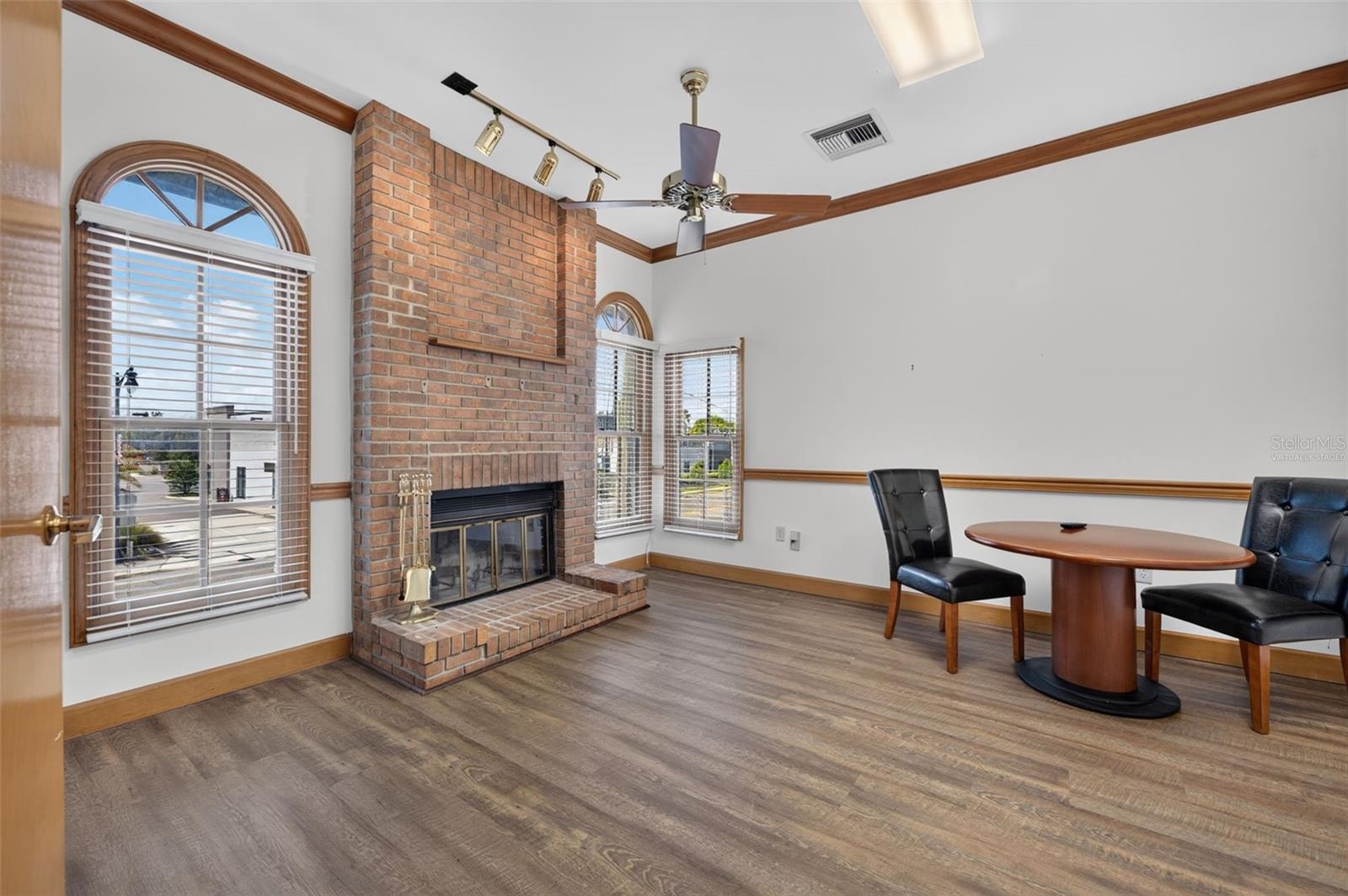 Executive office 2 with fireplace virtually staged