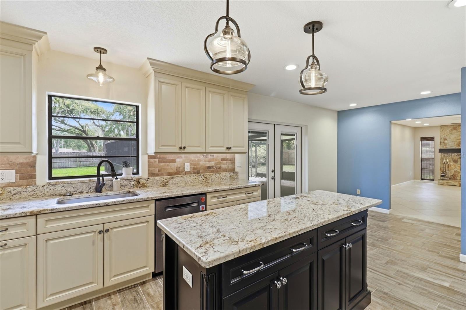 Kitchen looking at breakfast nook and living room