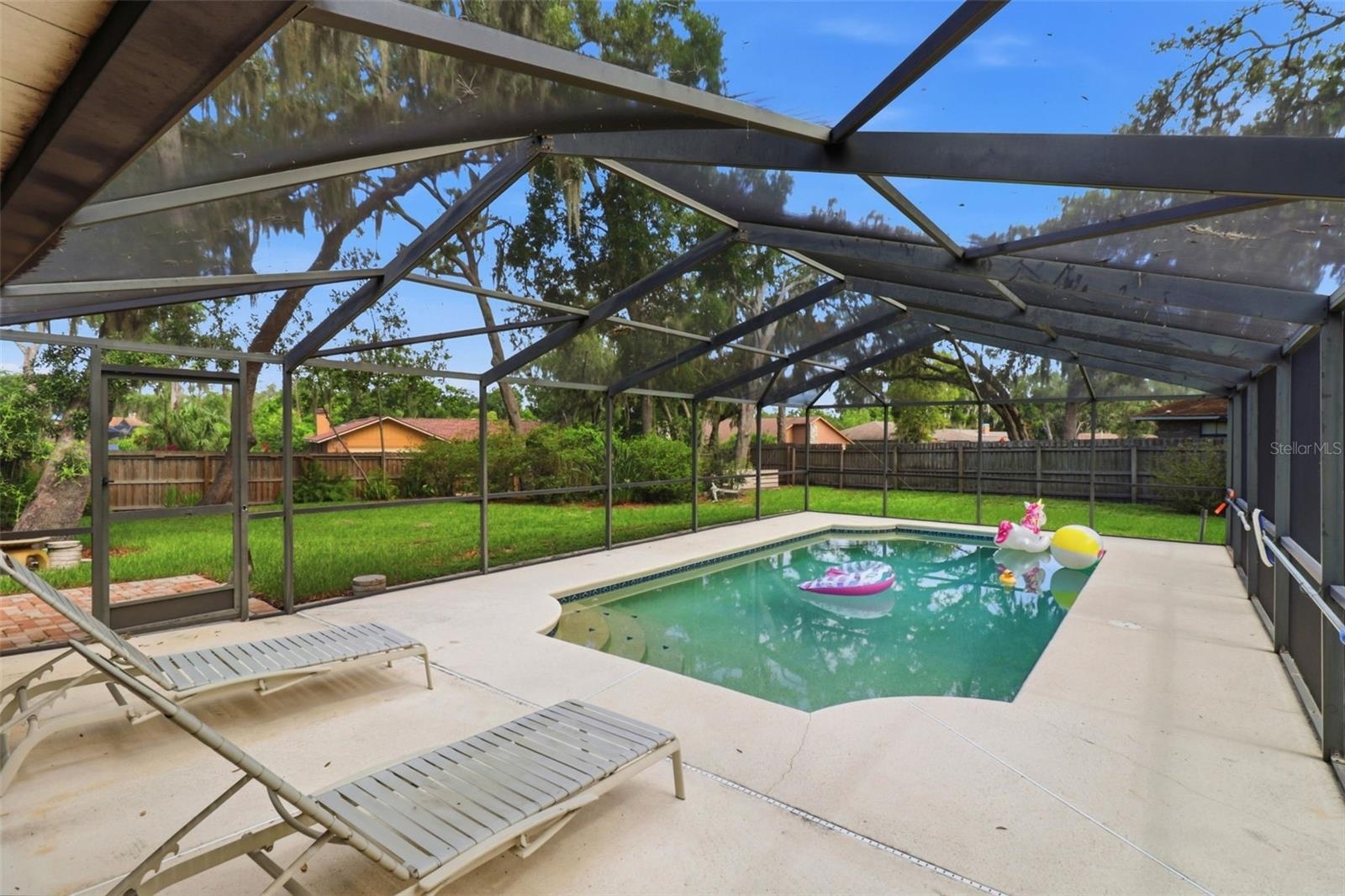 Beautiful pool and view of large private backyard