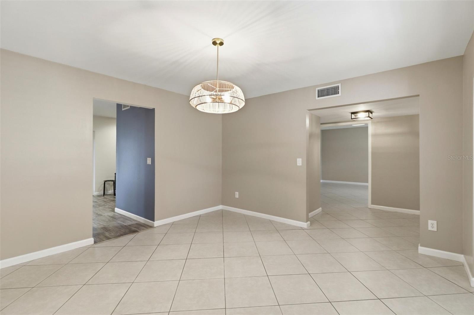 Dining room with view into kitchen and office/flex space