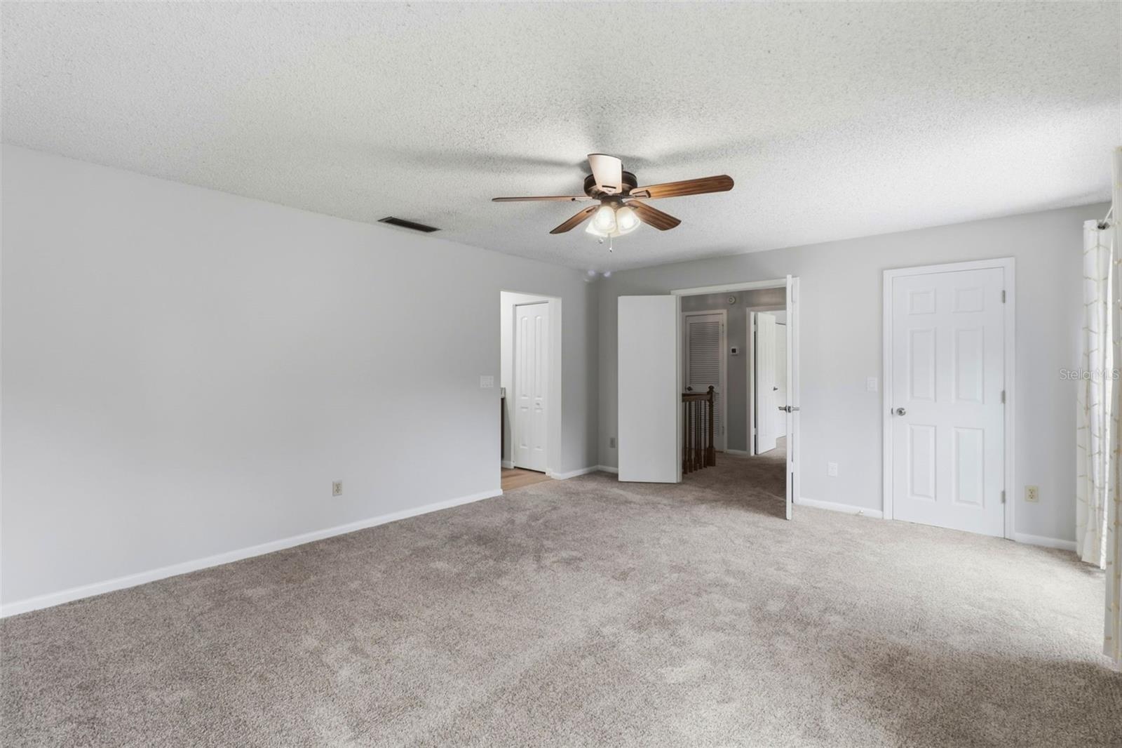 Primary bedroom with double door entry, Walk-in closet and ensuite