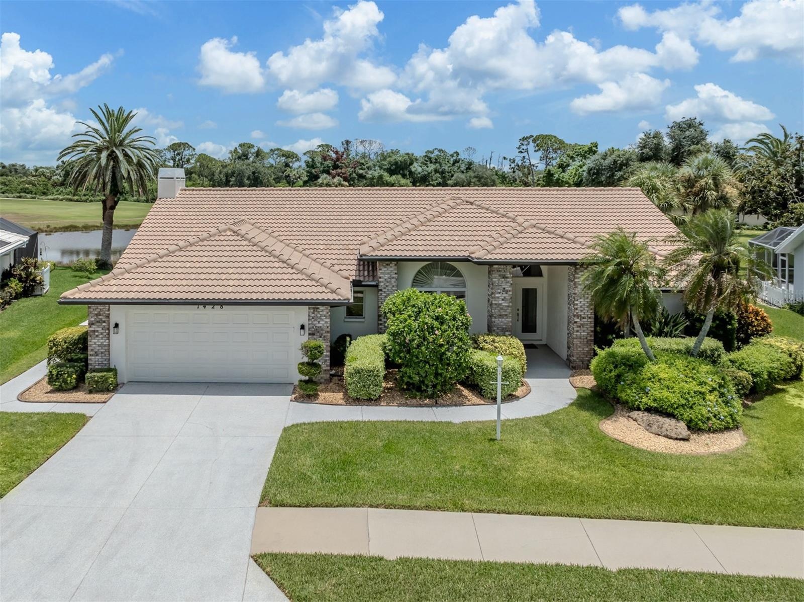 Beautifully positioned on larger lot with both water and golf course views