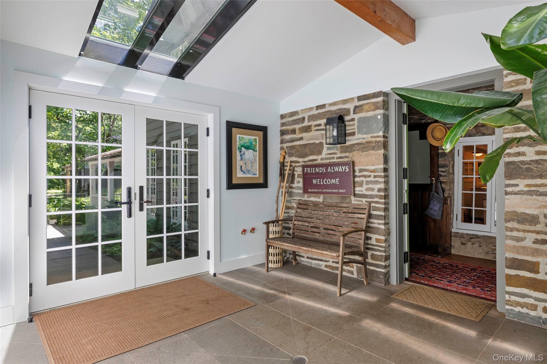 Welcoming foyer with skylights and original stone walls