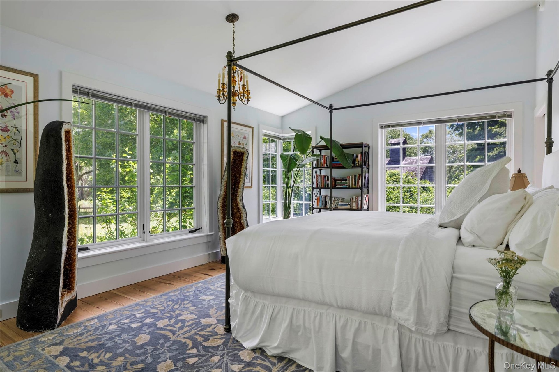Vaulted ceiling with dual-aspect windows overlooking the gardens