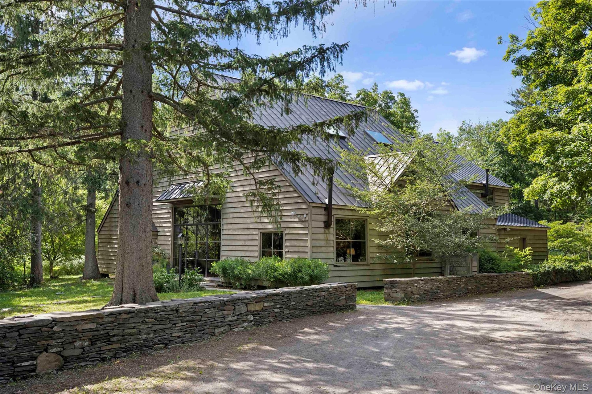 The Broken Wing Barn showcases its beautifully restored post-and-beam architecture, blending historic character with thoughtful craftsmanship