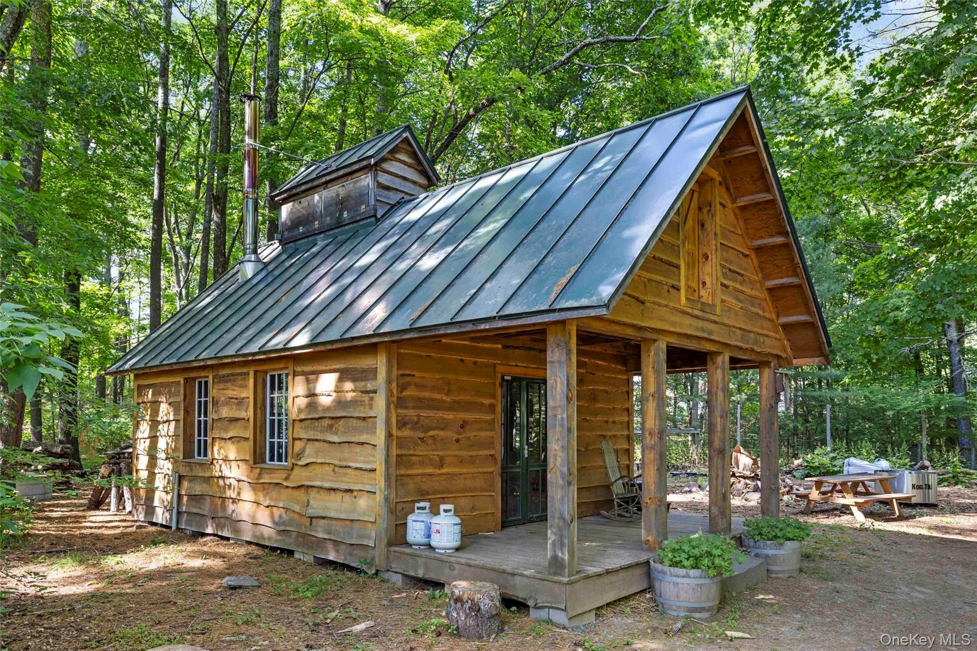 Traditional sugar shack nestled among the woodlands, supporting maple syrup production