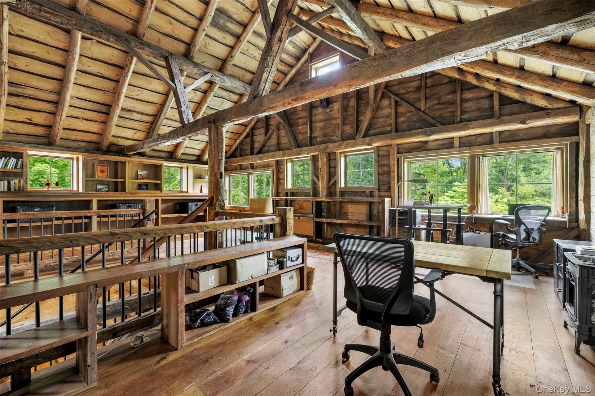 Upper gallery overlooking the great hall, ideal for a library, office, studio, or creative workspace