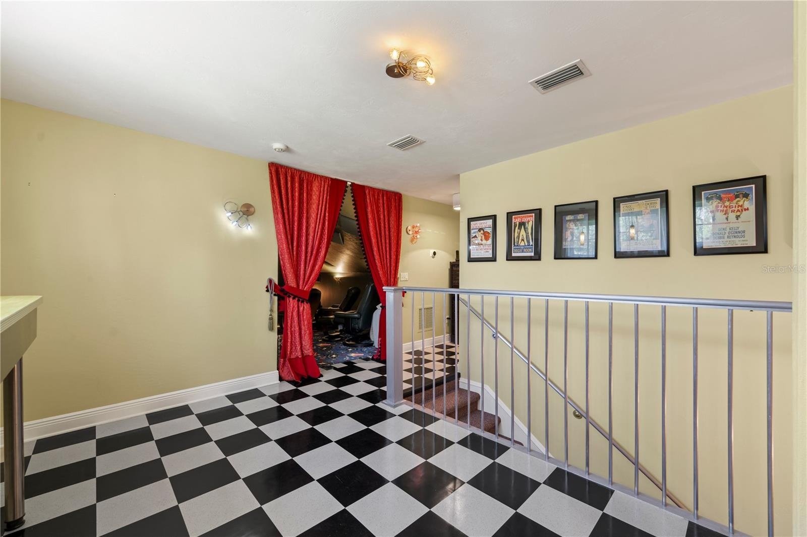 Behind the curtain awaits your private theater, while the retro-inspired lounge outside sets the stage for intermission drinks, conversation, and a li