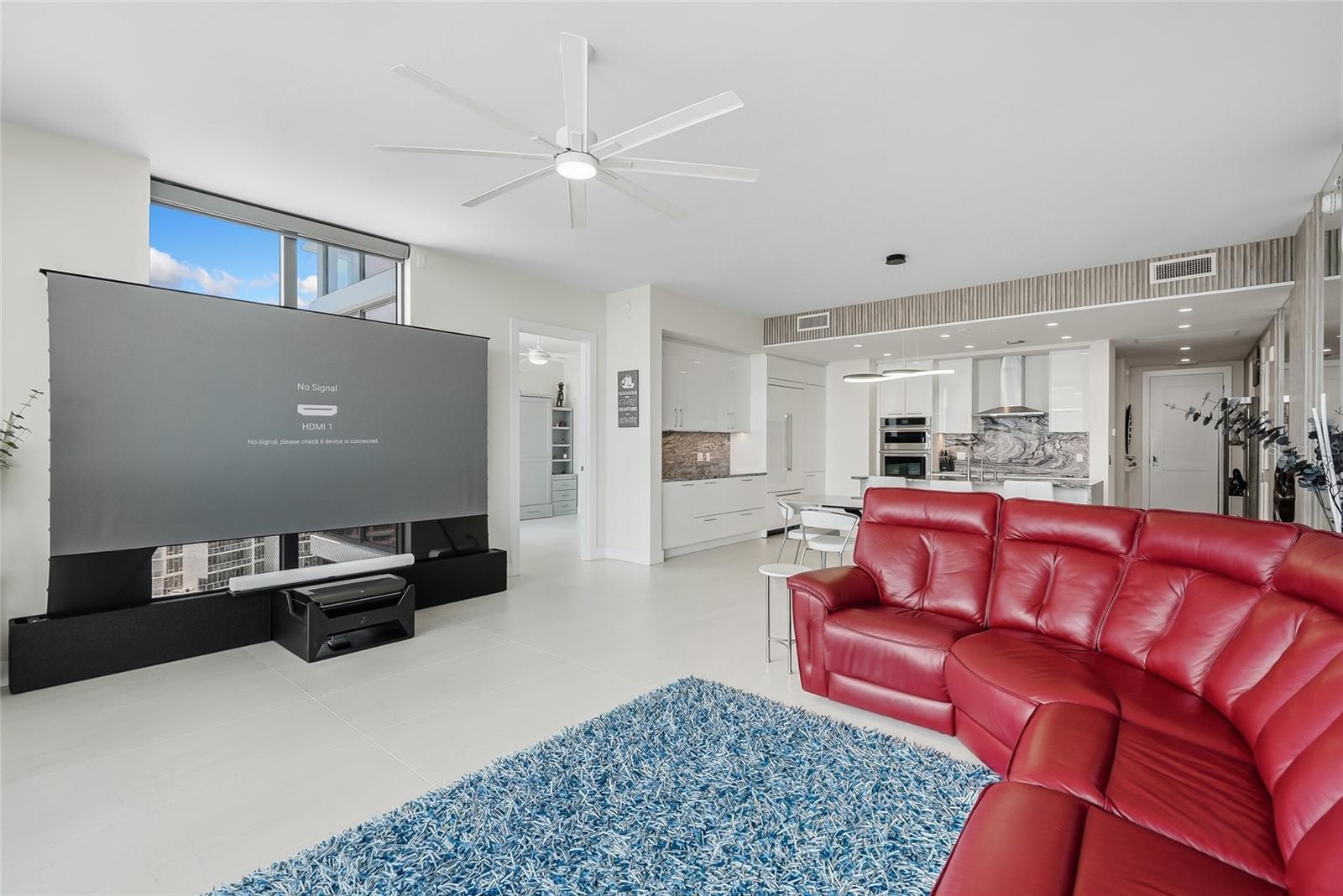 120” state-of-the-art projection TV that rises from the floor and a Sonos surround sound system.