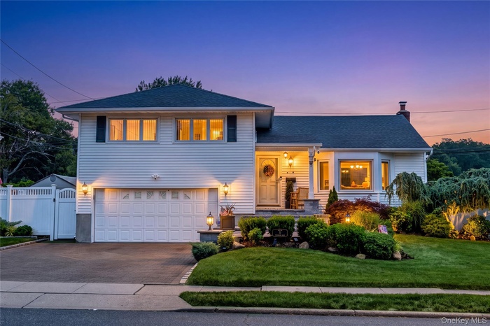 Stunning Landscaping. Paver Driveway and front patio. Amazing Curb Appeal. Edited to show home in Dusk